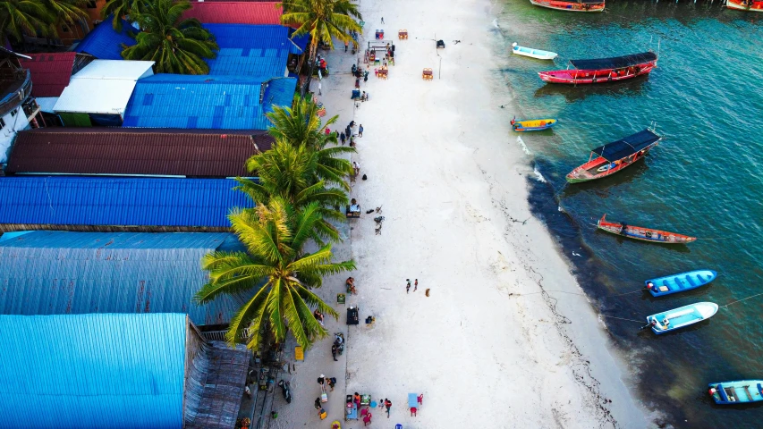 several boats are on the beach in the water