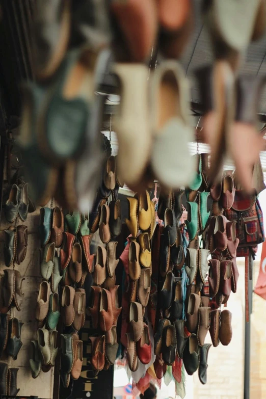 many shoes are hanging up in this shop