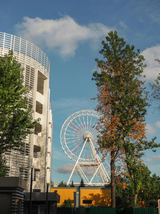 a ferris wheel in between two large buildings