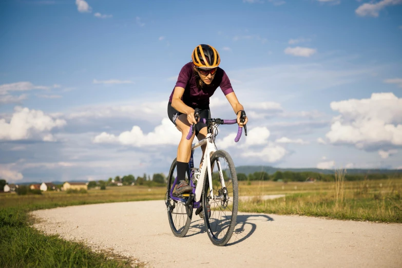 this is a picture of a man riding a bicycle on a trail