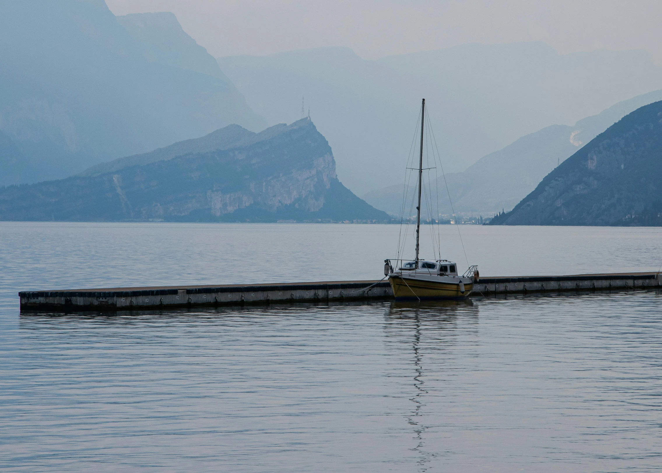 a small boat in the middle of the lake