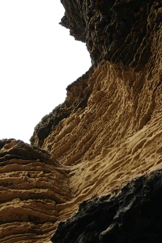 a rocky, brown area with many layers of sand