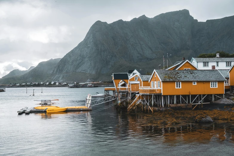 a boat dock and house built in an ocean