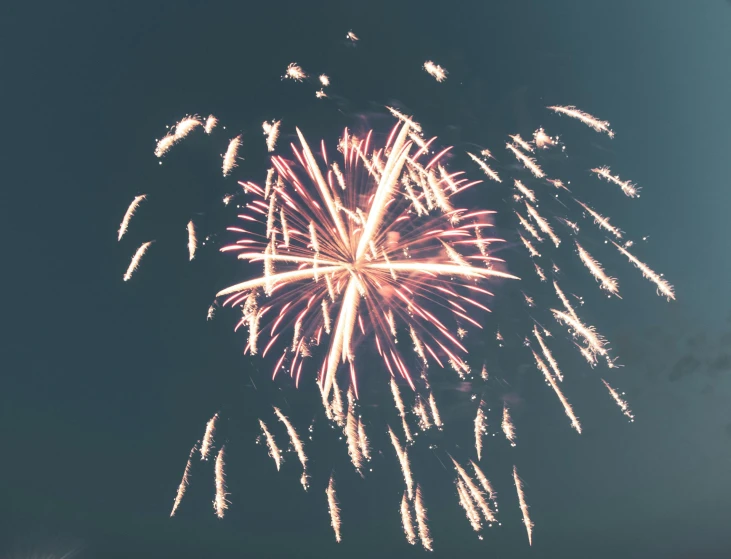 a fireworks in the dark sky with it's long exposure