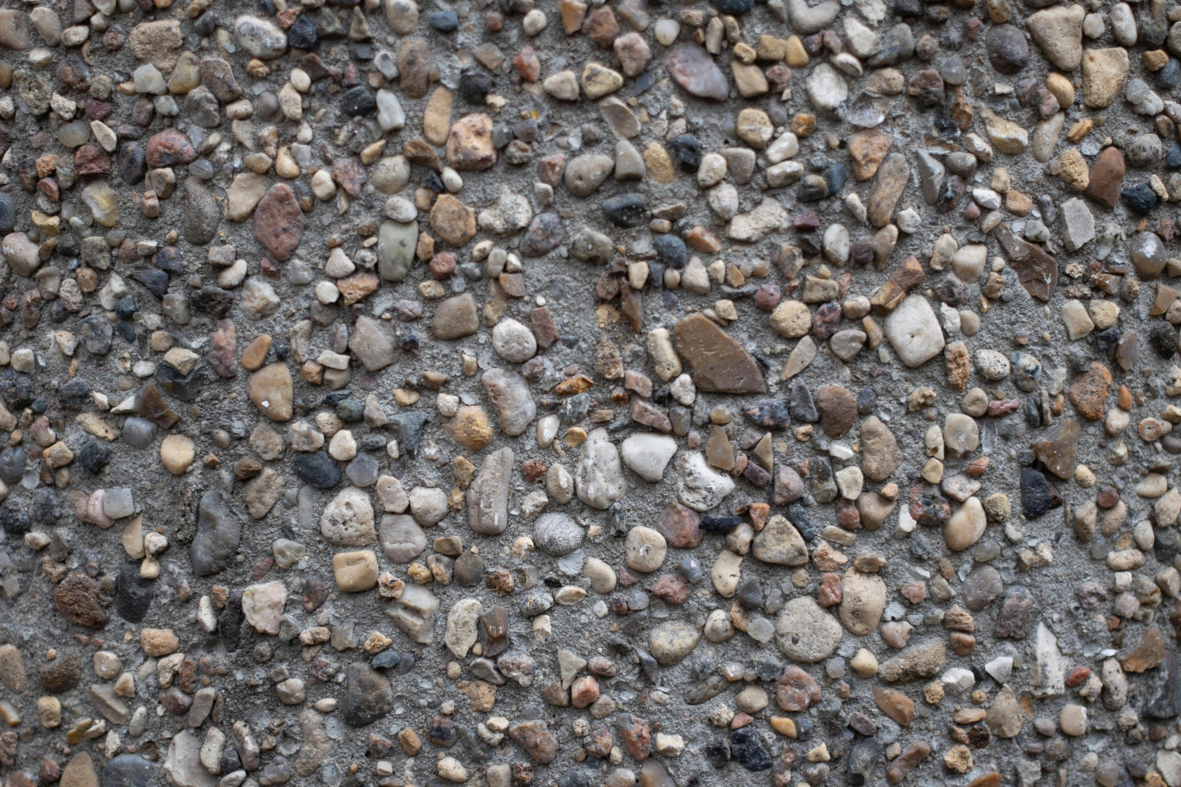 some rocks and gravel laying on the ground