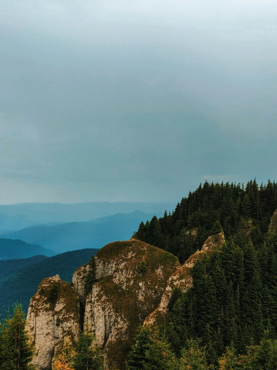 there are mountains in the distance with blue and gray sky