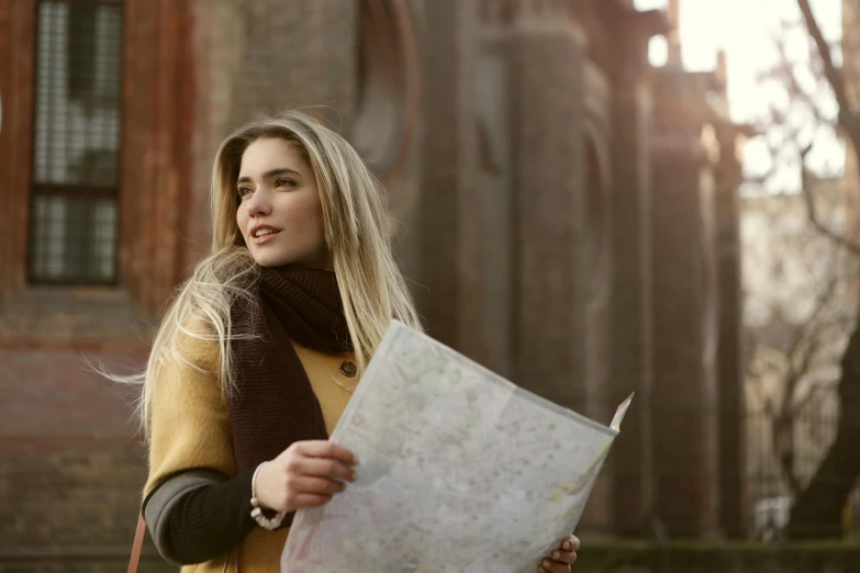 a woman looking at her map and smiling