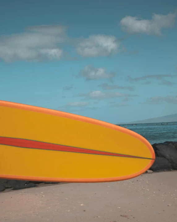 the bottom side of a surfboard at the beach