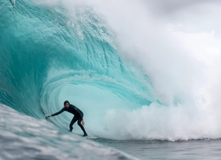 a surfer is riding a wave in the ocean