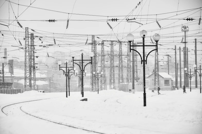 power lines are in a snow covered city