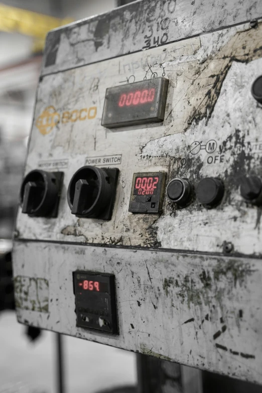 old mechanical machine sitting inside of a building