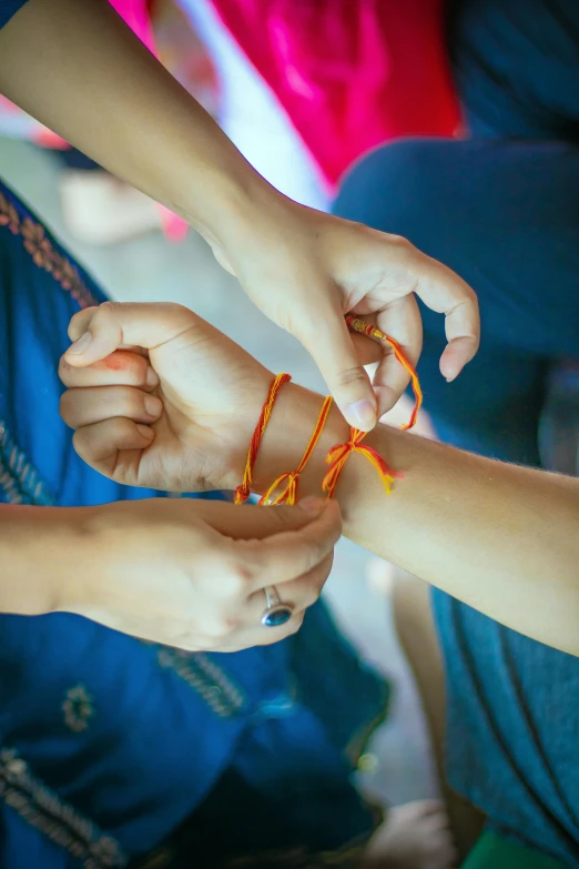 two children are playing with yarn and plastic