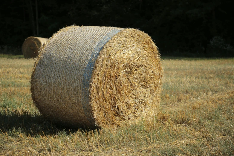 the hay is stacked neatly into a circular piece