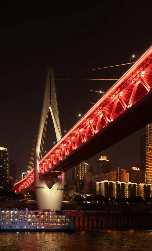 the bridge lights are changing colors in the night