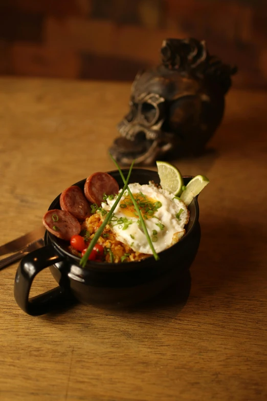 a bowl filled with food next to another bowl on a table