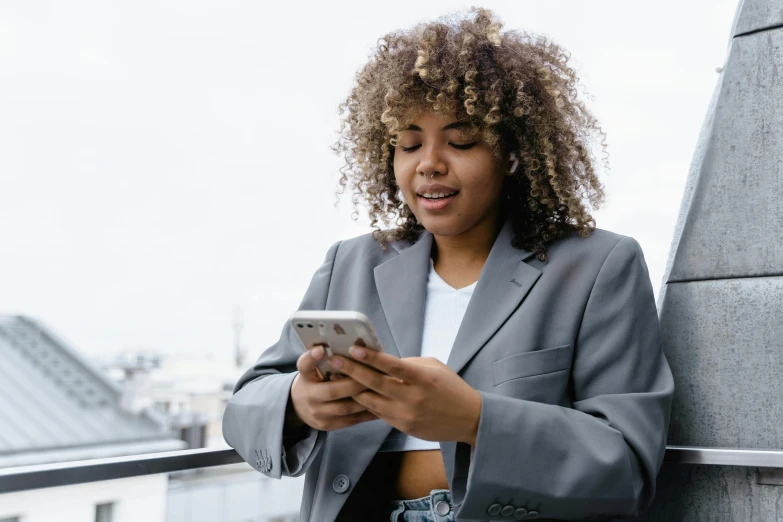 an image of a woman looking at her phone