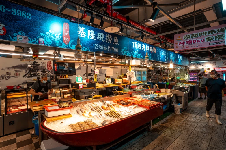 people standing in line to buy seafood at the tsuki seafood market