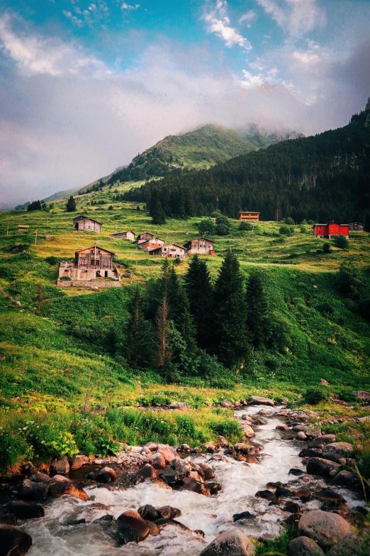 an old stone house on a rocky hillside