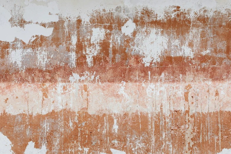 old dirty paint and water on an orange and white wall