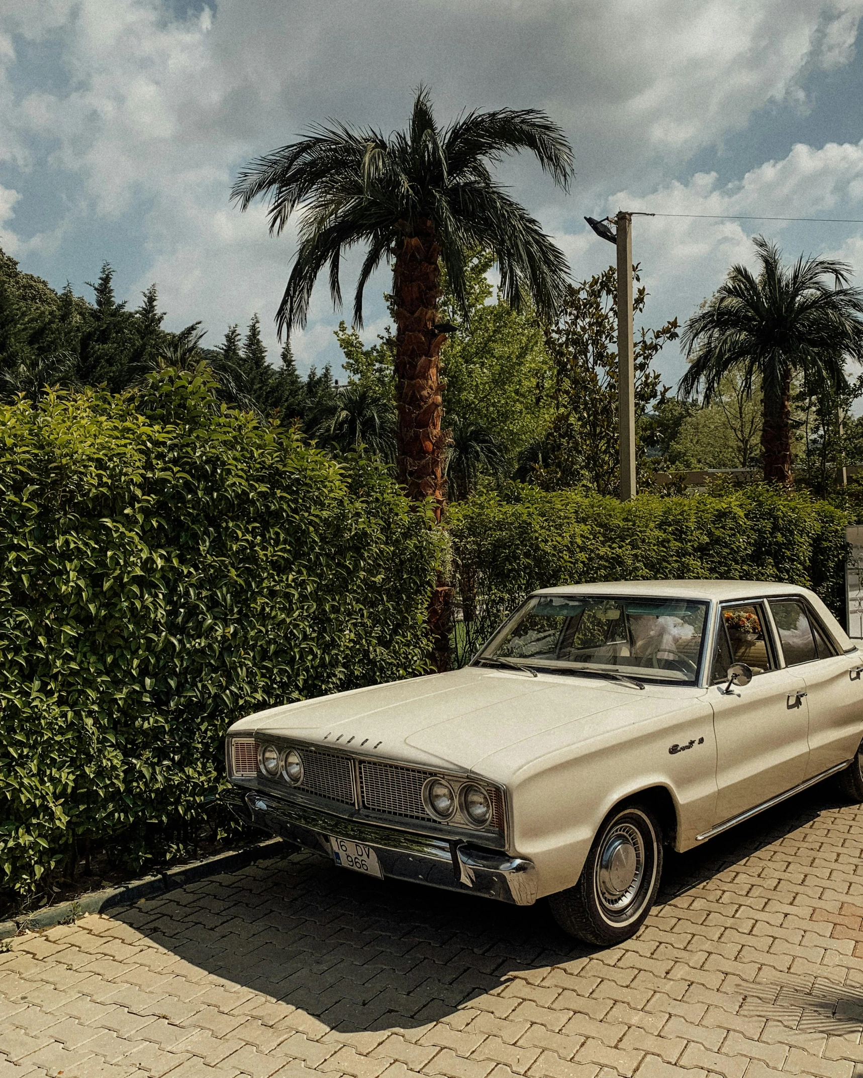 an old car parked on the side of the road