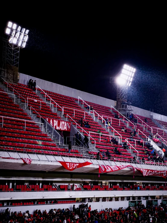 an arena with a large crowd at night