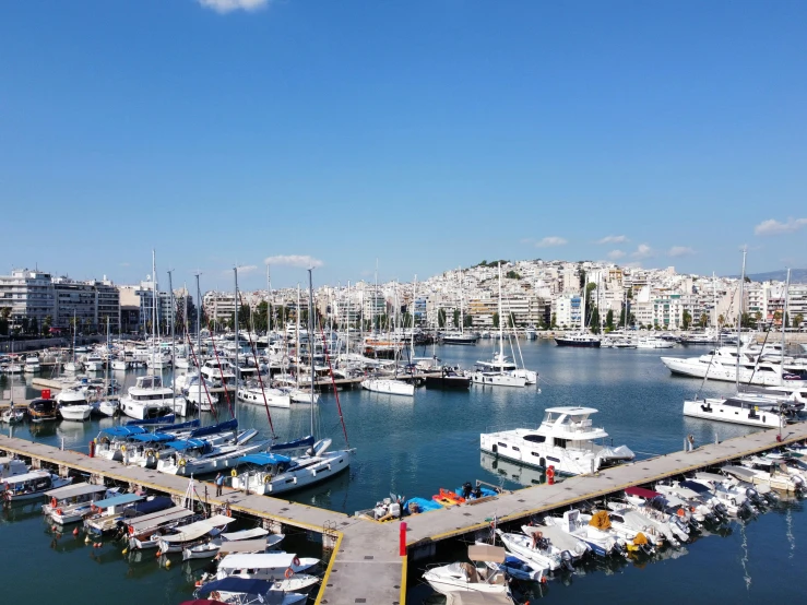 a view of the marina, several boats in it and several buildings in the background