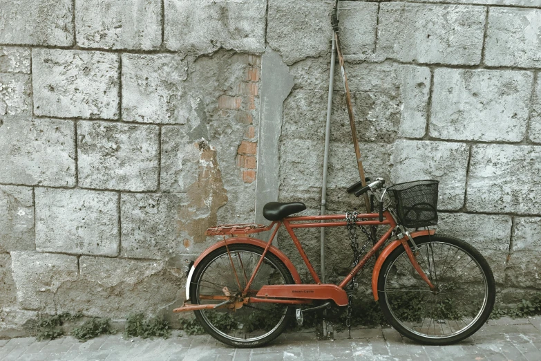 a bike parked up against the wall of a house