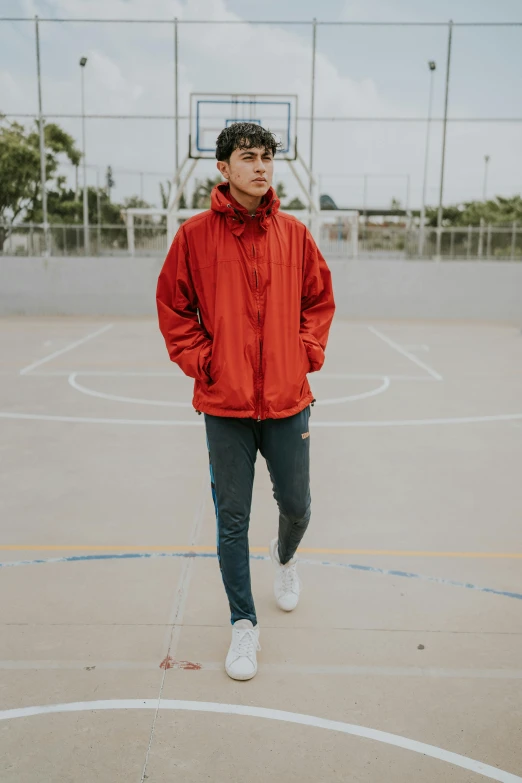 a person that is standing up on a basketball court