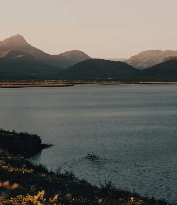 a body of water surrounded by mountains