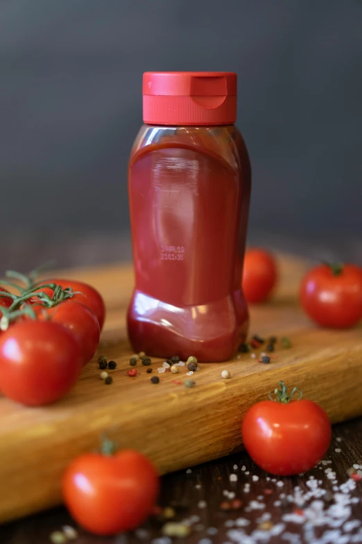 tomatoes and tomatoes are laying next to the jar