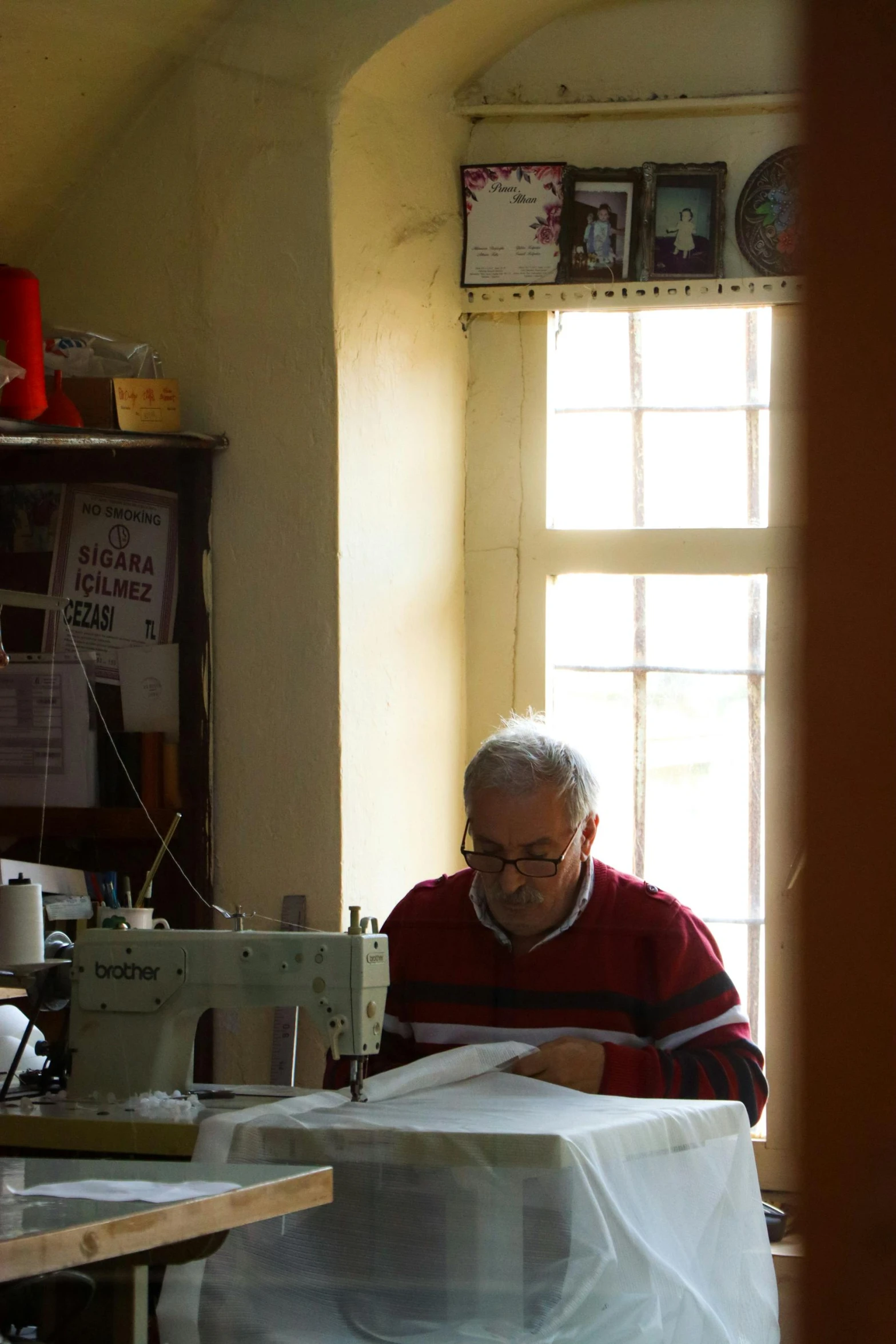 a man working on a sewing machine