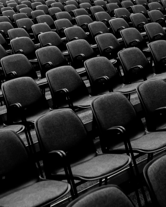 a group of chairs in an empty stadium