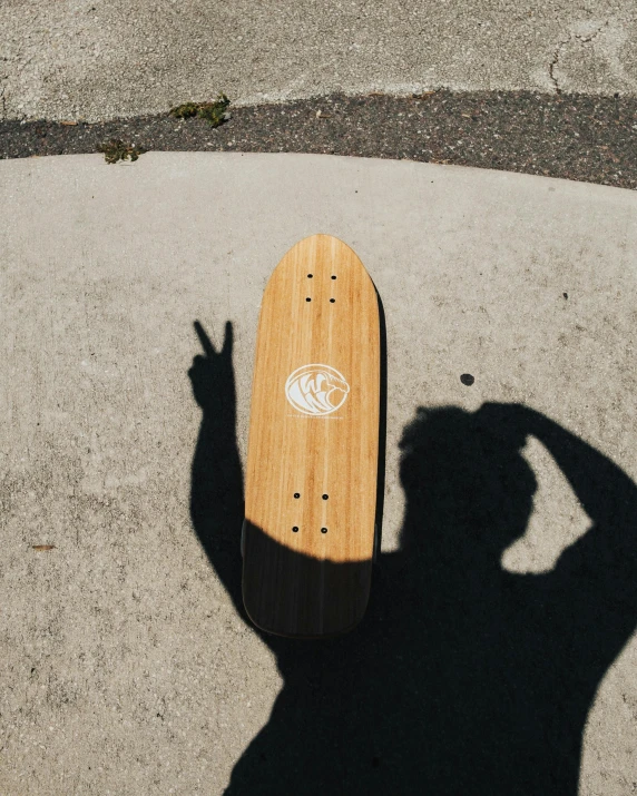 a skateboard with a skate board sticker attached to it