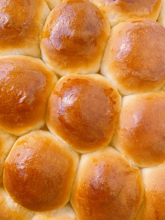 a group of round bread rolls covered in lots of bread