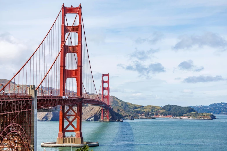 a bridge is spanning into the water below