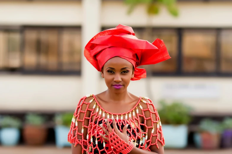 a young lady wearing a bright red outfit