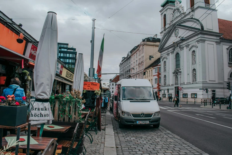 a white truck parked on the side of a street