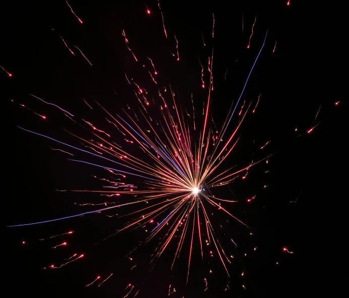a close up view of fireworks against a black sky