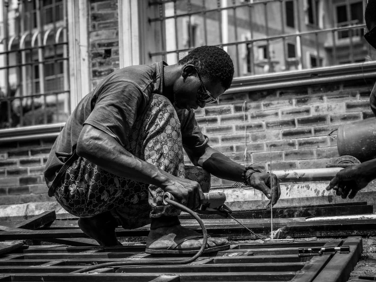 an older woman cuts into soing on top of wooden boards