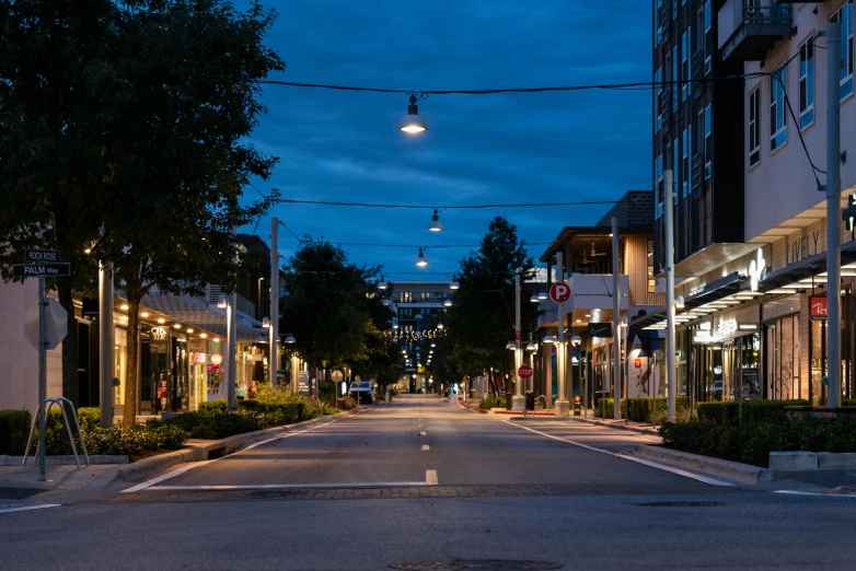 a street with the lights on at night