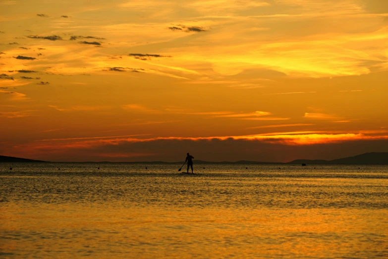 a person on a surf board in the water