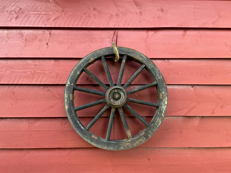 the wheels are hanging on the wall beside the door