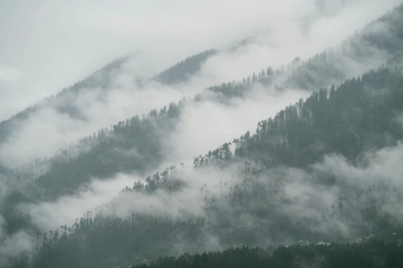 a hill with a bunch of clouds over it