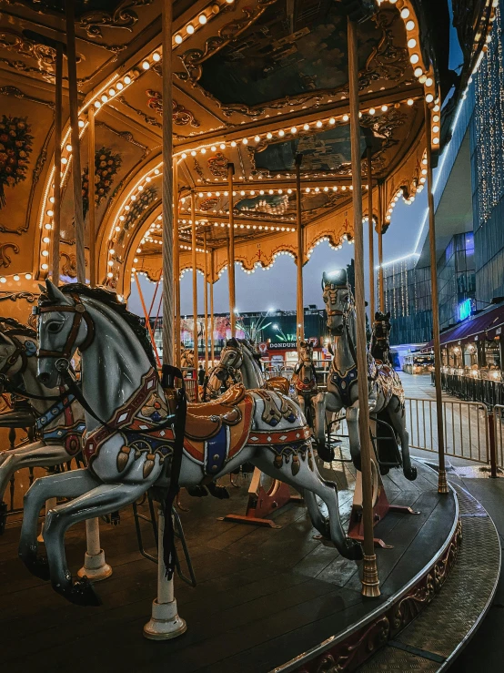 a merry go round at night with lots of lights