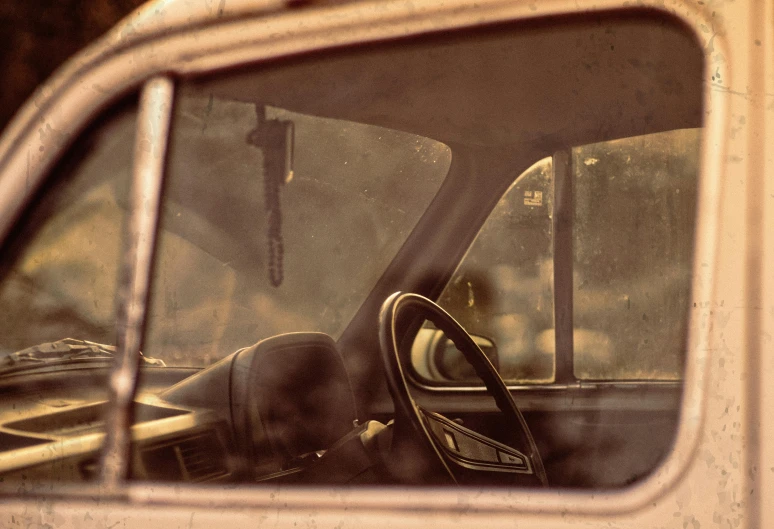 a view from inside a vehicle showing the driver's hand side mirror