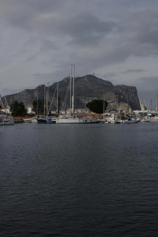 boats docked at a harbor in a lake