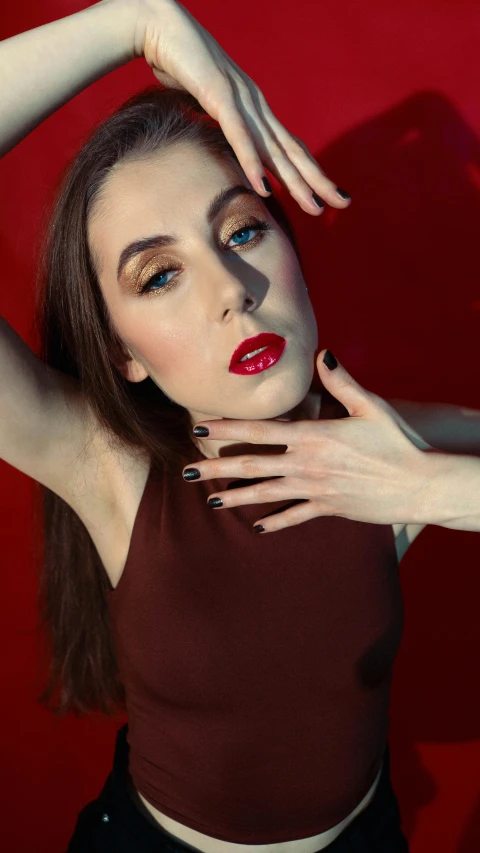 a woman with a red lipstick and black dress