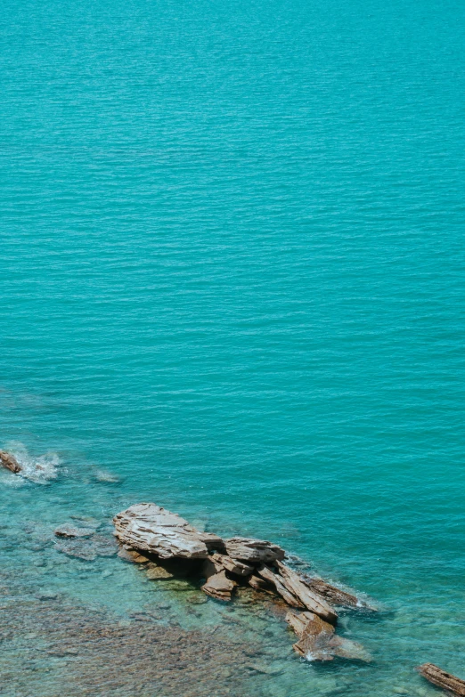 a man is out on the water with his surfboard