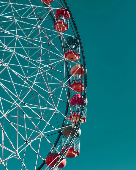 a large ferris wheel against a blue sky