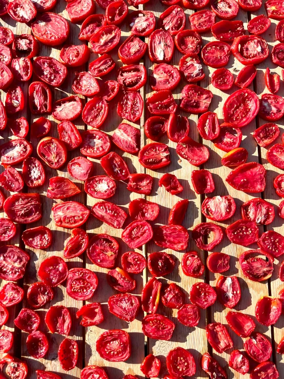 dried red onions laid out on a table for cooking